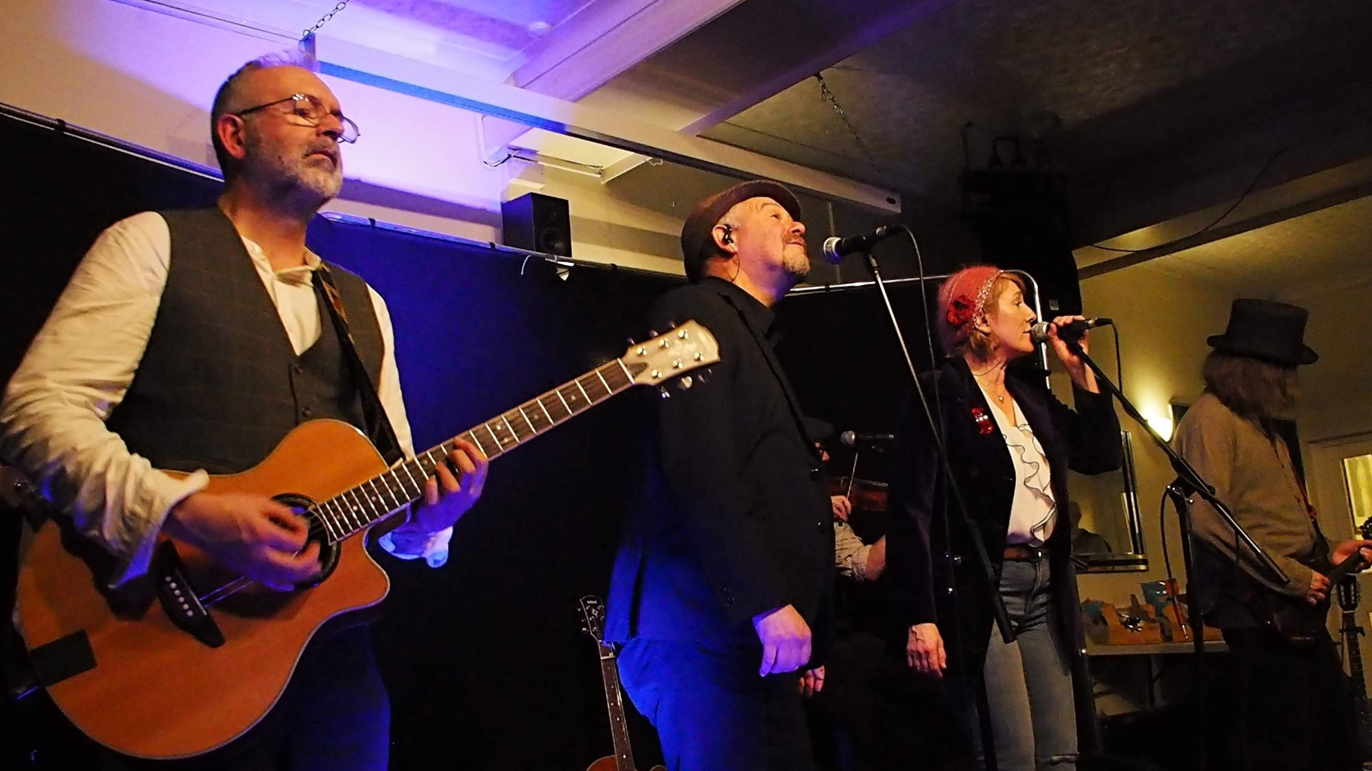 John, Andrew, Virginia and Bob Kettle from Merry Hell playing on stage